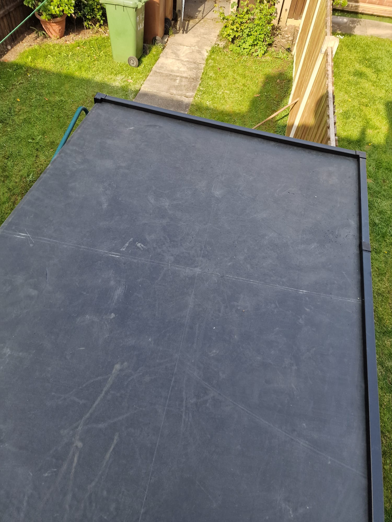 Completed EPDM rubber flat roof on a Yorkshire single-storey extension overlooking a garden